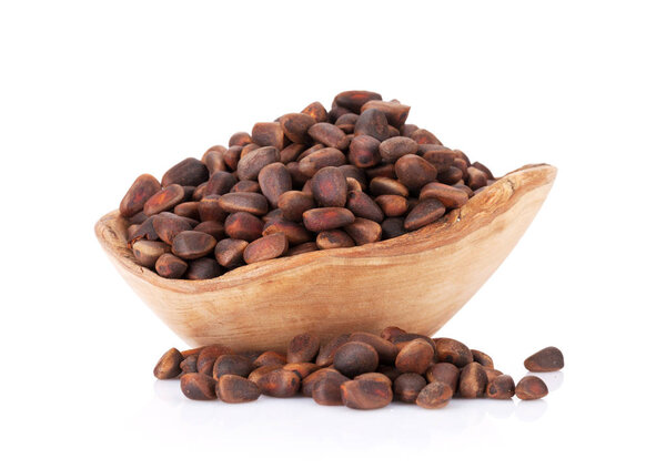 Pine nuts in wooden bowl
