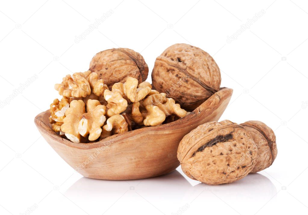 Walnut nuts in wooden bowl