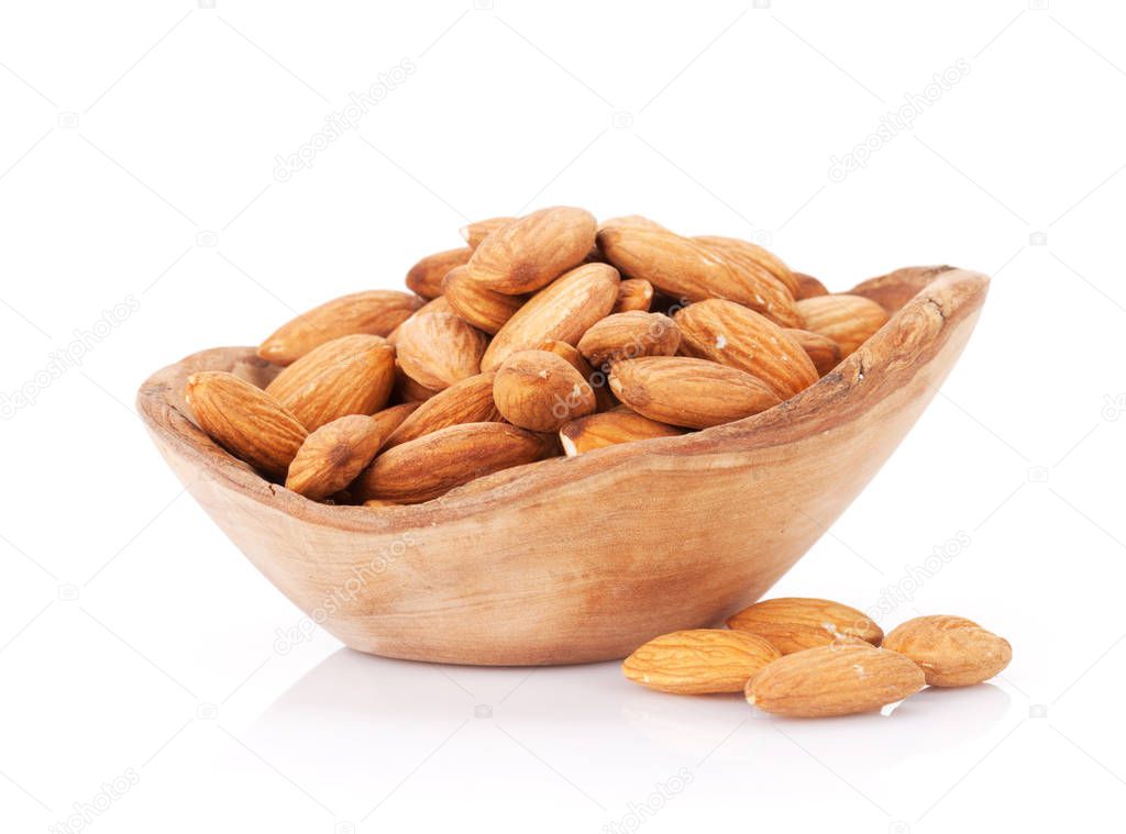 Almond nuts in wooden bowl