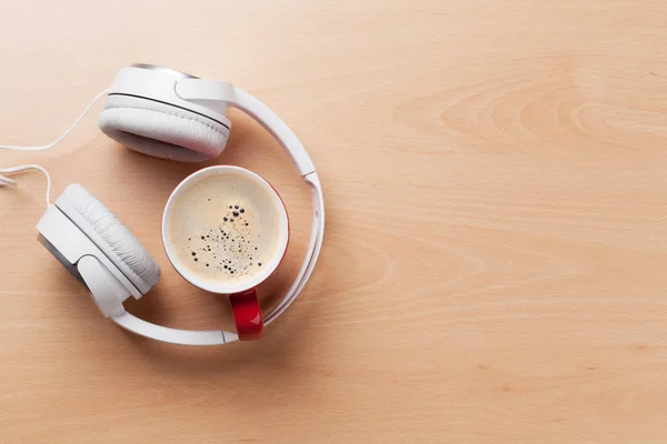 Headphones and coffee cup — Stock Photo, Image