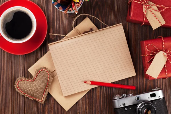 Gifts, camera, coffee and notepad — Stock Photo, Image