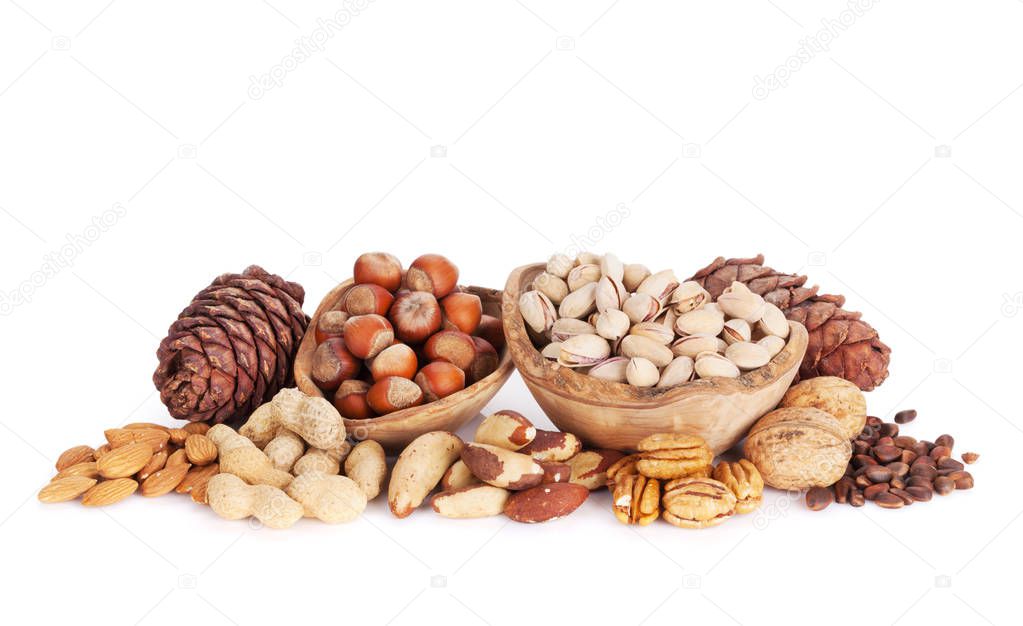 Various nuts in wooden bowls