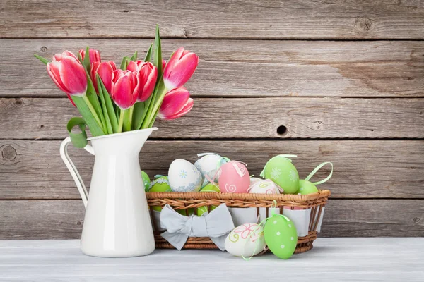 Easter eggs and red tulips