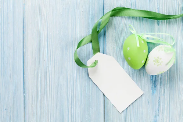 Easter eggs and blank tag label — Stock Photo, Image
