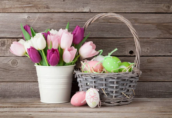 Easter eggs and colorful tulips