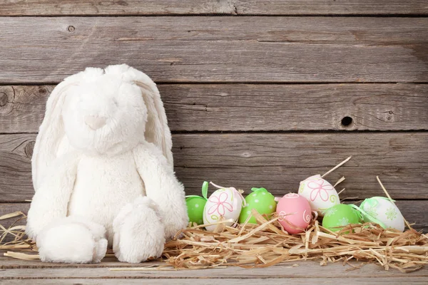 Rabbit toy and easter eggs — Stock Photo, Image