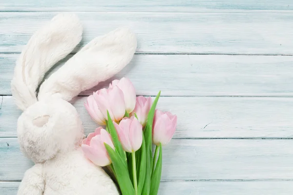 Pink tulips and rabbit toy — Stock Photo, Image