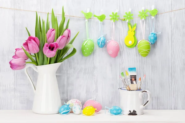 Easter eggs and pink tulips bouquet — Stock Photo, Image