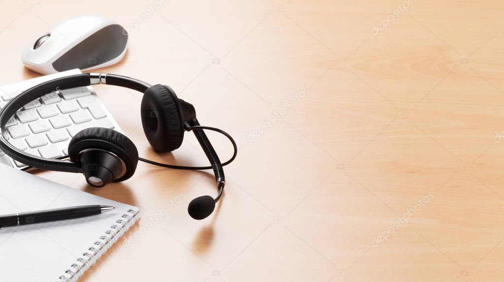 Office desk with headset and pc