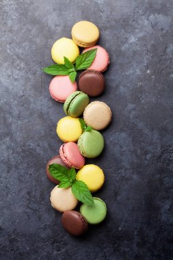 Colorful macaroons on table clipart