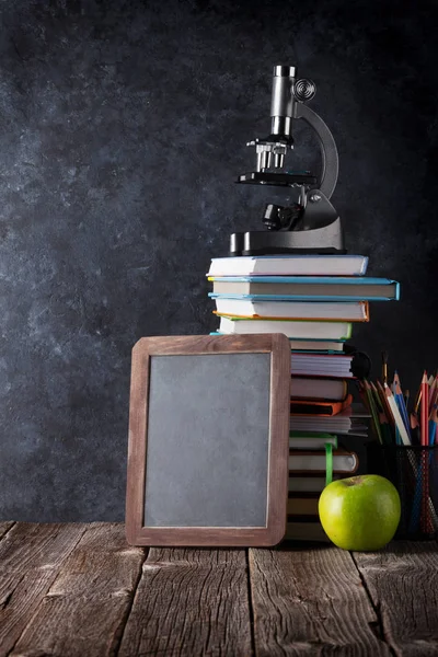 Books, supplies and chalk board