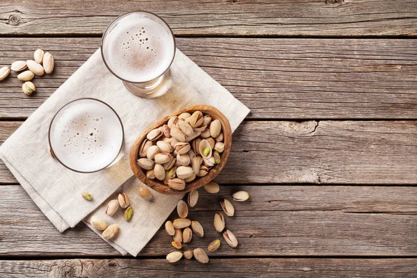 Beer glasses and snacks — Stock Photo, Image