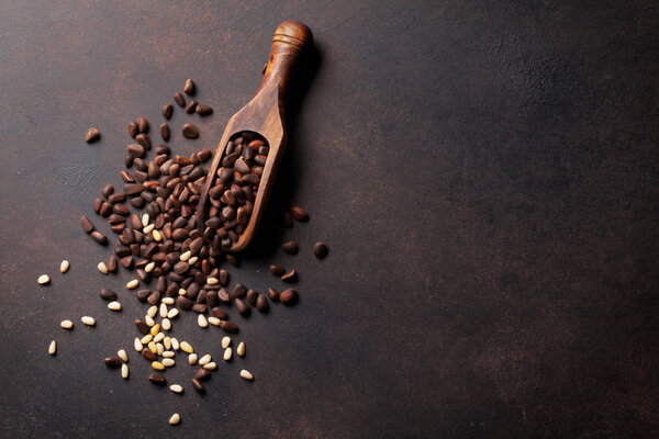 Pine nuts in wooden spoon 