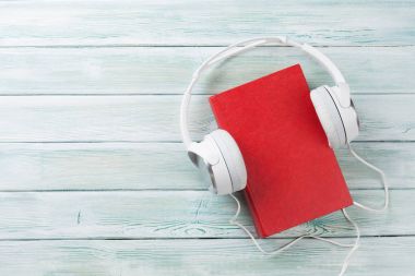 Headphones and red book  clipart