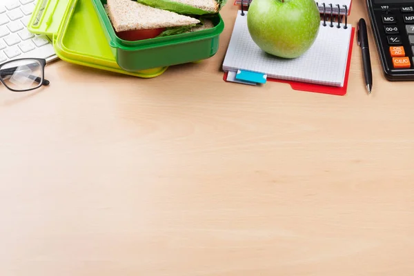 Office supplies and lunch box with vegetables — Stock Photo, Image