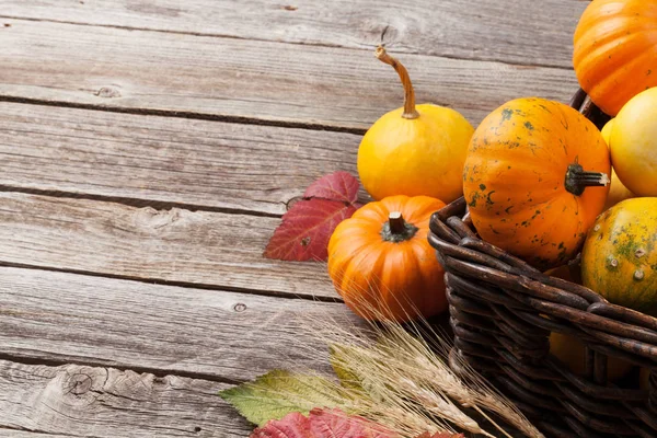 Autumn pumpkins on wooden table — Stock Photo, Image