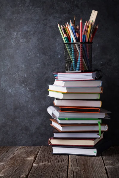 Stack of books and supplies — Stock Photo, Image