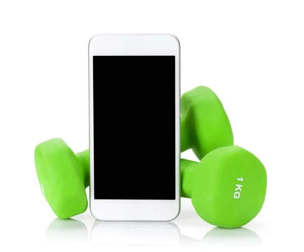 Green dumbbells dan smartphone — Stok Foto