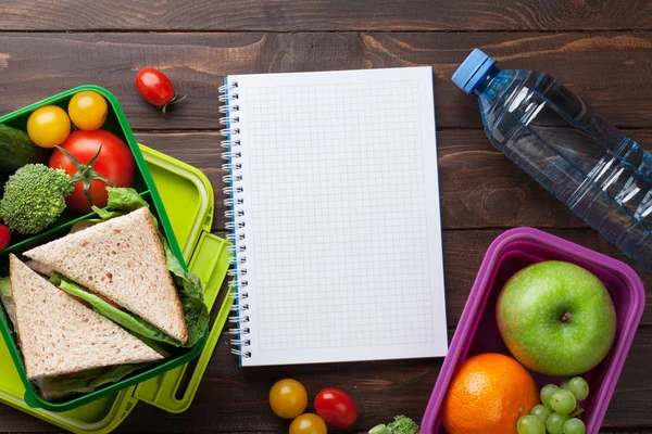 Lunch box and notepad — Stock Photo, Image
