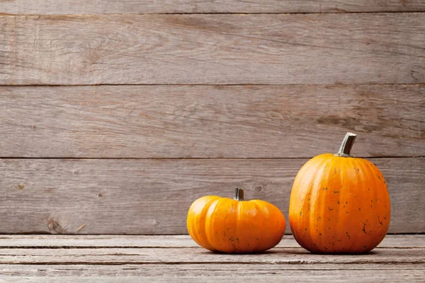 Autumn pumpkins on table — Stock Photo, Image