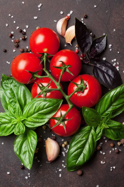 Tomatoes and basil on table — Stock Photo, Image