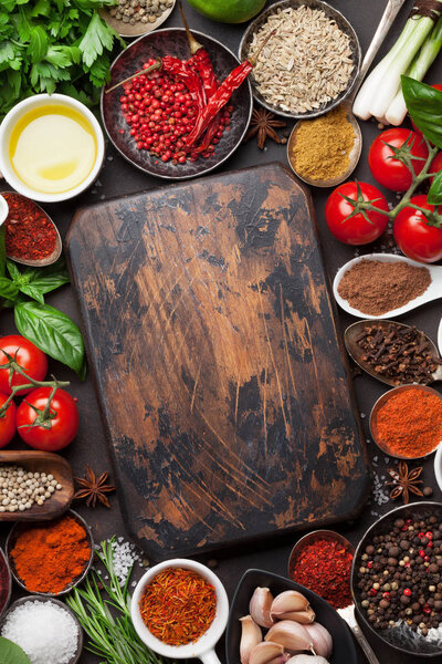 spices and herbs with cutting board