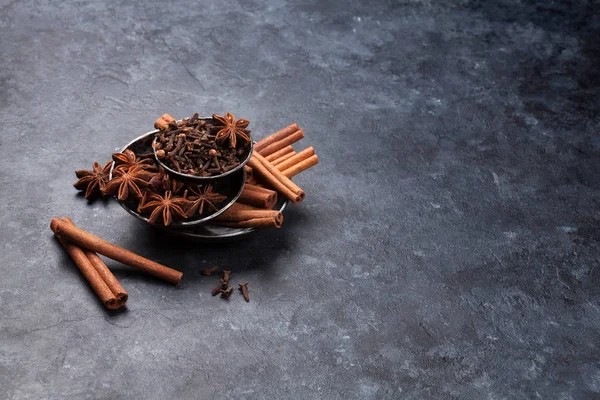 Various spices in bowls over stone — Stock Photo, Image