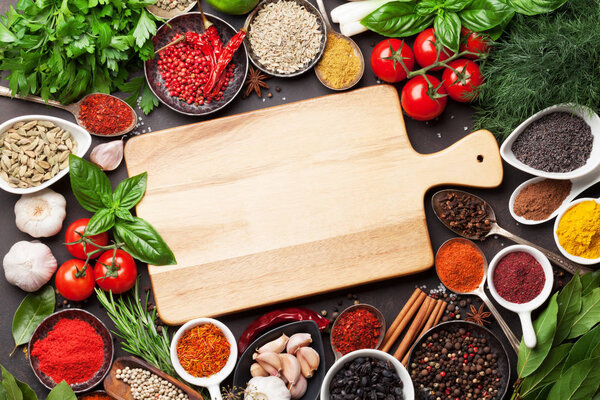 spices, herbs and cutting board 
