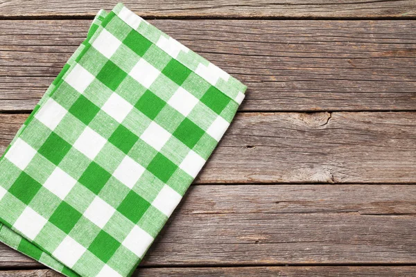 Kitchen towel on wooden table — Stock Photo, Image