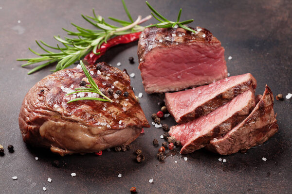 Grilled fillet steak on stone table