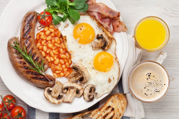 Fried eggs, sausages, bacon — Stock Photo, Image