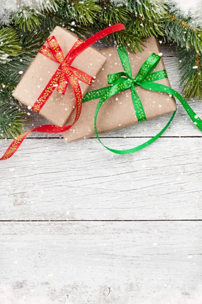 Christmas gift boxes and snow tree — Stock Photo, Image