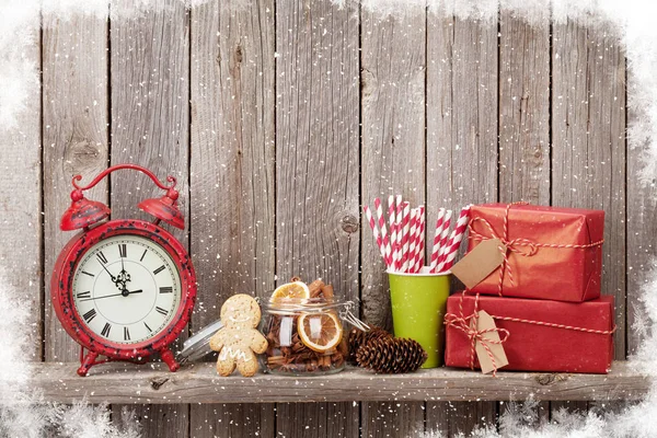 Christmas gift boxes, alarm clock and food decor — Stock Photo, Image