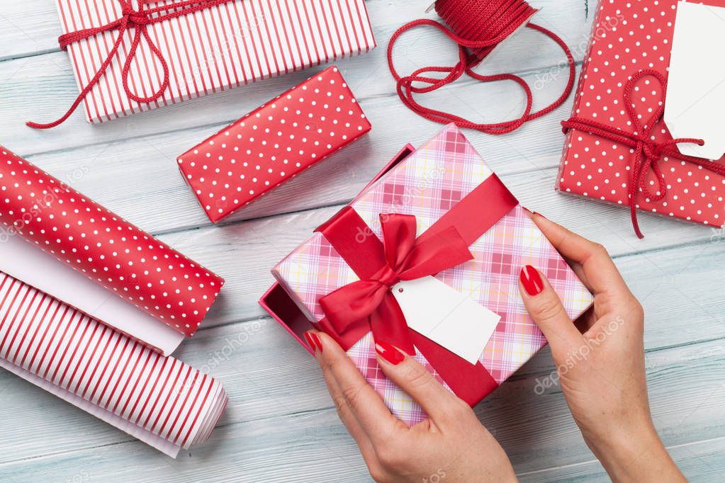 Female wrapping christmas gifts