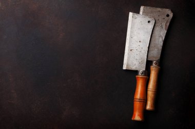 Kasap. Vintage et bıçakları taş tablo üzerinde. Üstten Görünüm alanı ile