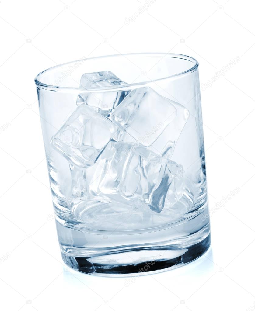 Glass with ice cubes isolated on white background