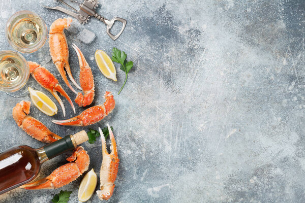 Seafood. Oysters, lobster, clams and white wine. Top view on stone table with space for your text