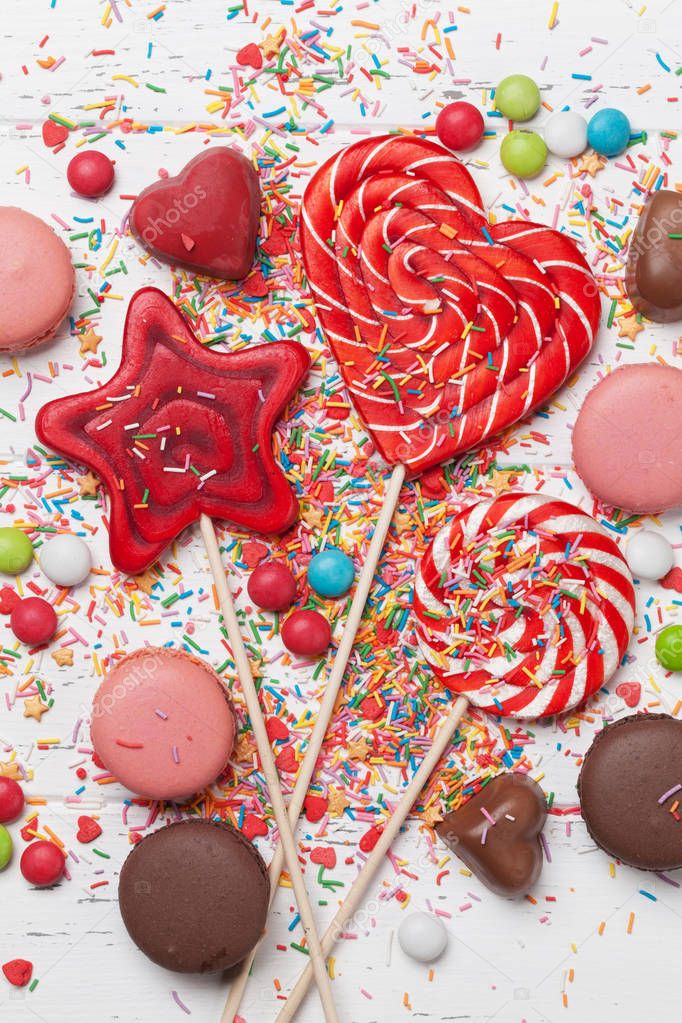 Colorful sweets. Lollipops, macaroons, candies. Top view