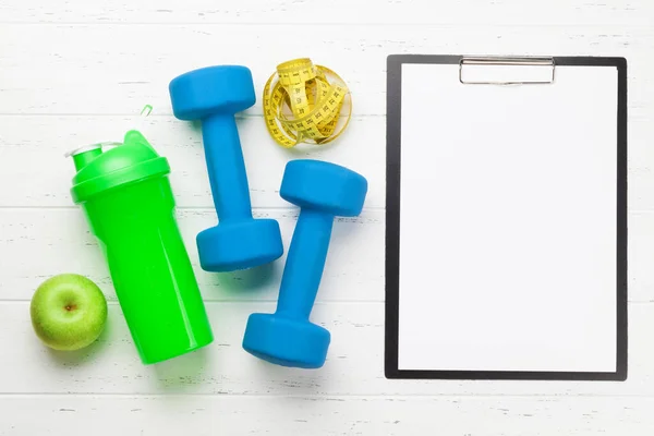 Fitness Equipment Blank Sheet Workout Plan Wooden Background Top View — Stock Photo, Image