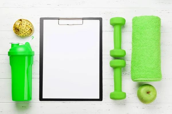 Fitness Equipment Blank Sheet Workout Plan Wooden Background Top View — Stock Photo, Image