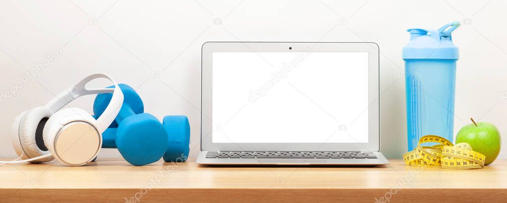 Healthy lifestyle, fitness, sport and online technology concept. Laptop and workout equipment. With copy space for your text or app