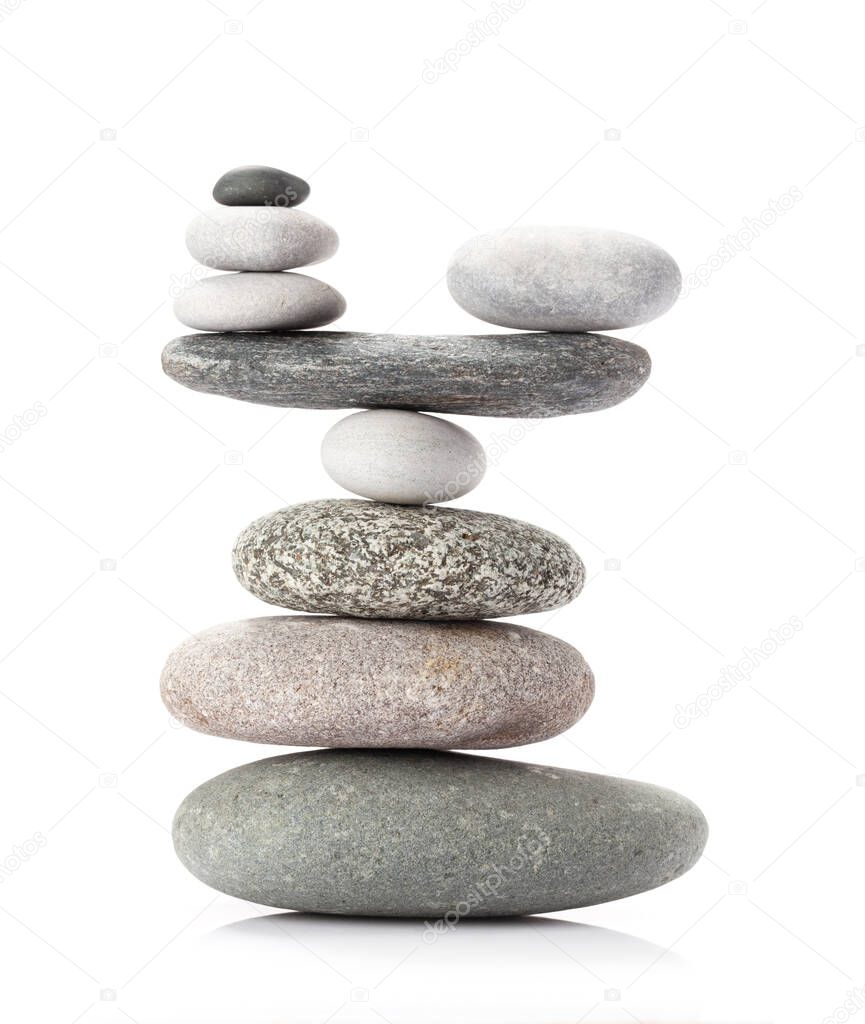 Pyramid of sea pebbles. Isolated on white background. Life balance and harmony concept