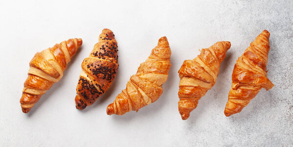 Fresh tasty croissants. Breakfast meal. Top view flat lay