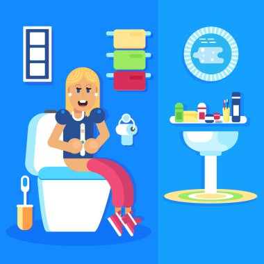 Genç kız tuvalete hamilelik testi ile oturma