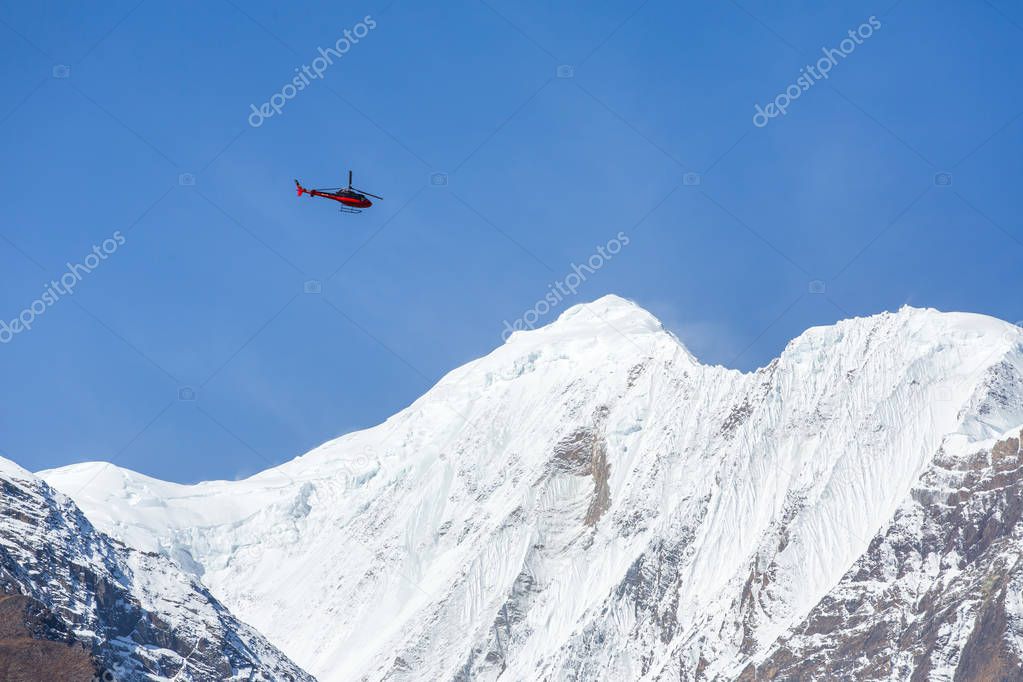 Rescue helicopter in high Himalayan mountains
