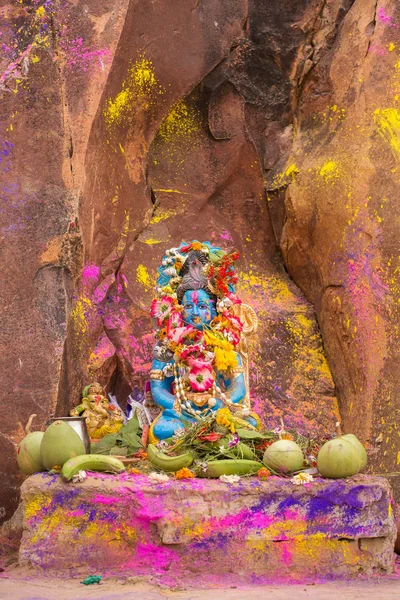 Krishna statue with flowers — Stock Photo, Image