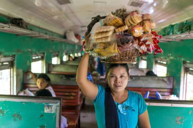 burmese woman selling snaks clipart