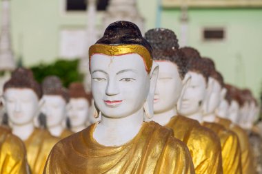 Buddha statues at the Maha Bodhi Tataung clipart