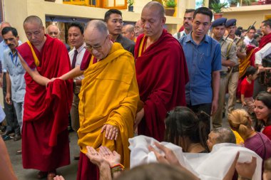 Dharamsala, India - June 6, 2017: His Holiness the 14 Dalai Lama Tenzin Gyatso gives teachings in his residence in Dharamsala, India. clipart