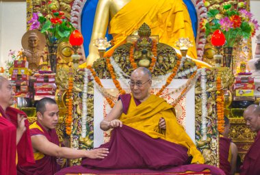 Dharamsala, India - June 6, 2017: His Holiness the 14 Dalai Lama Tenzin Gyatso gives teachings in his residence in Dharamsala, India. clipart